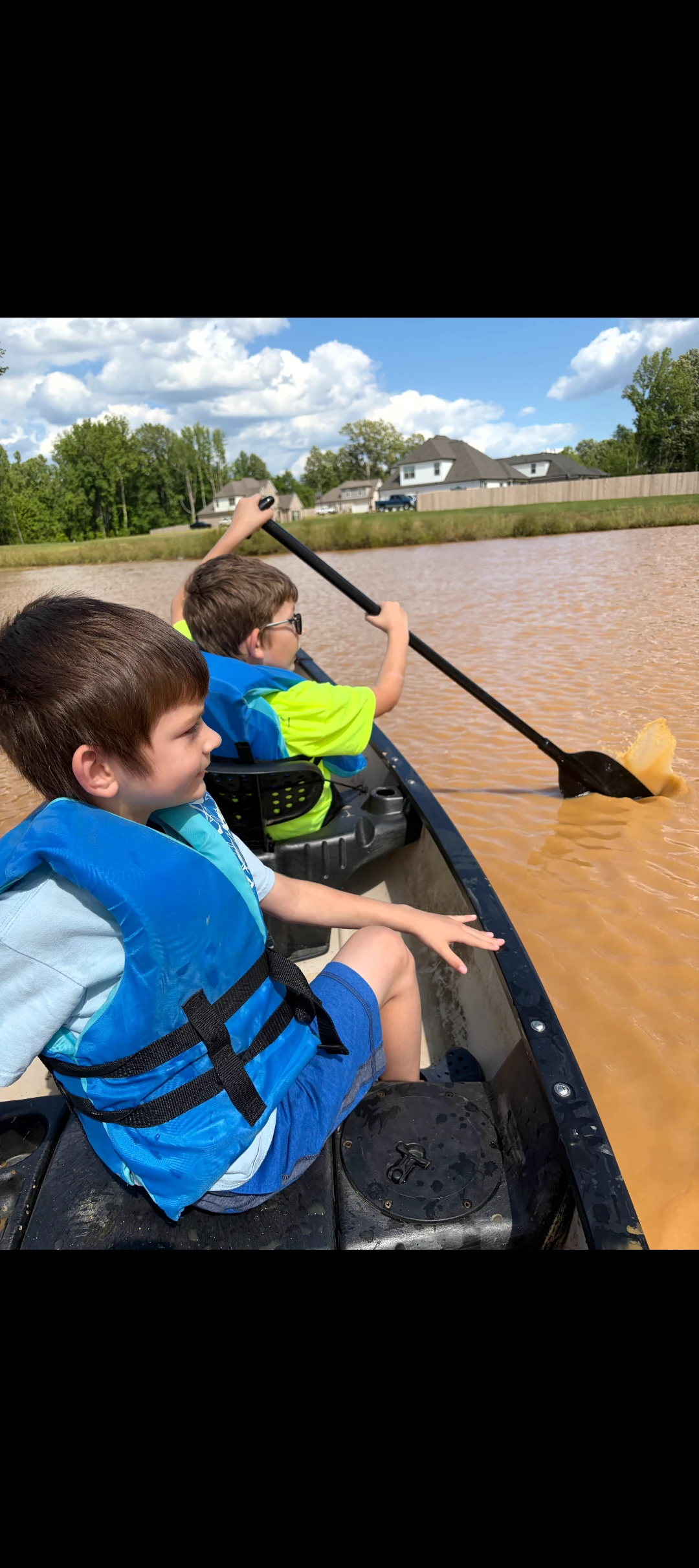 Chris canoeing with the boys
